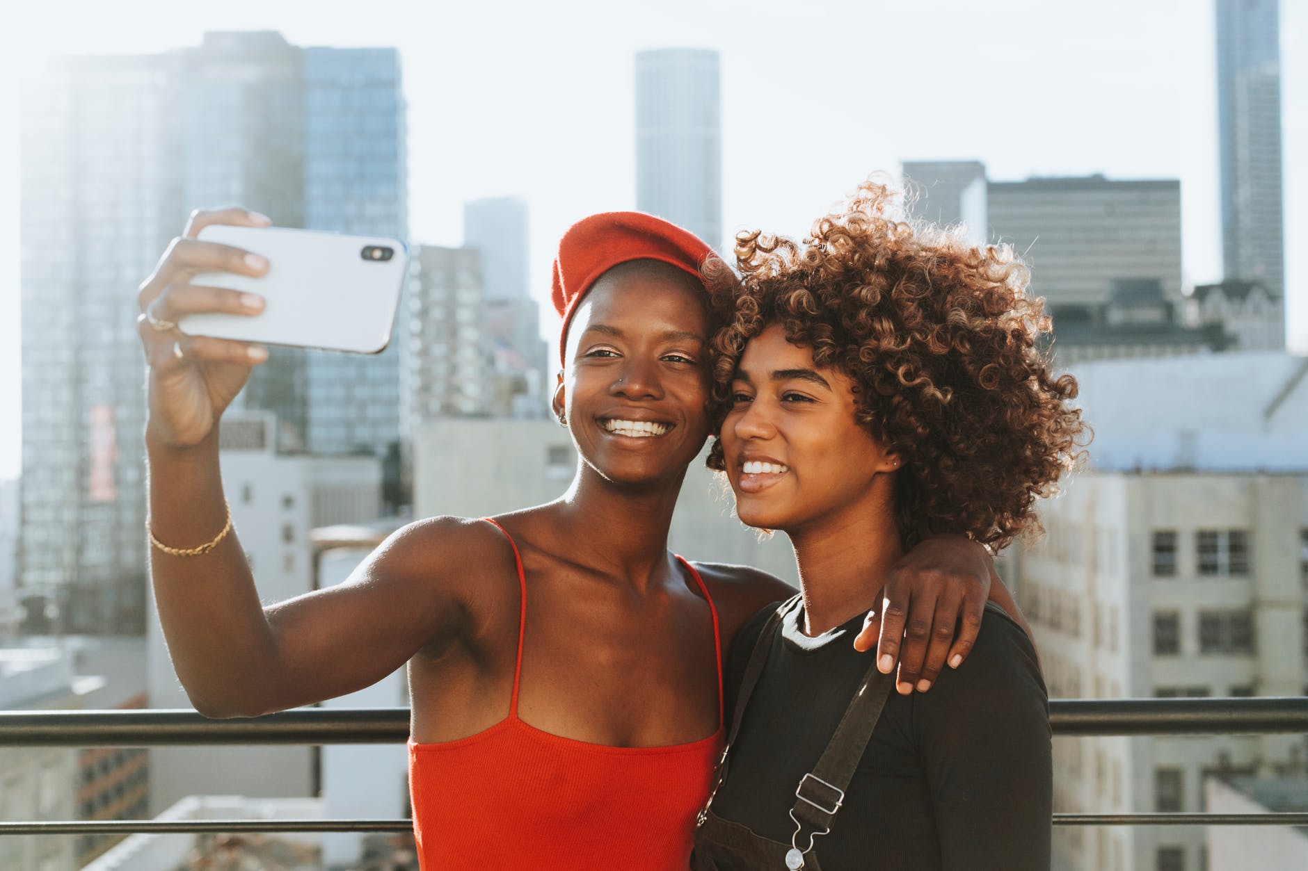 two women taking photo
